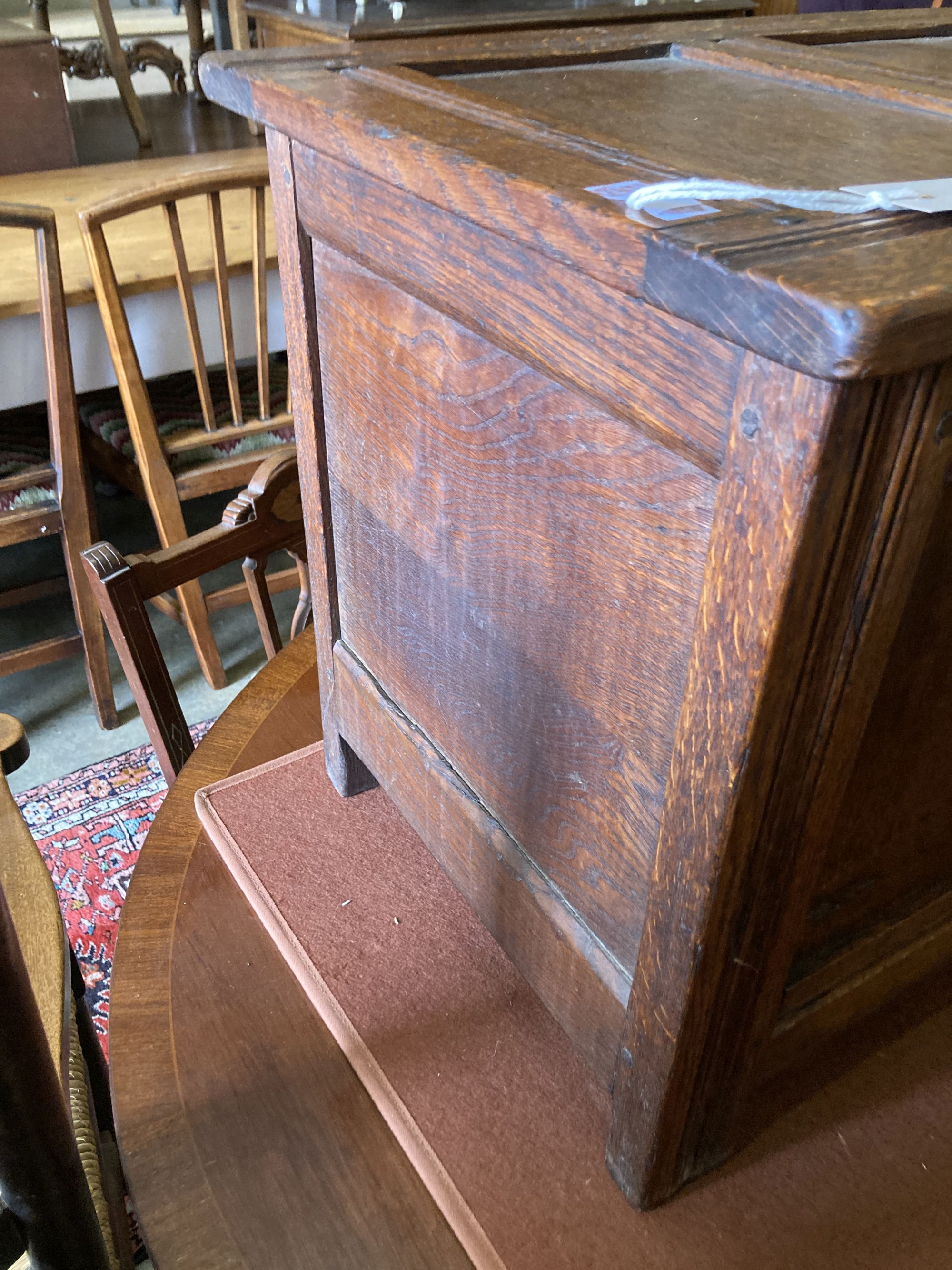 A small 18th century style panelled oak coffer, length 76cm, depth 40cm, height 45cm